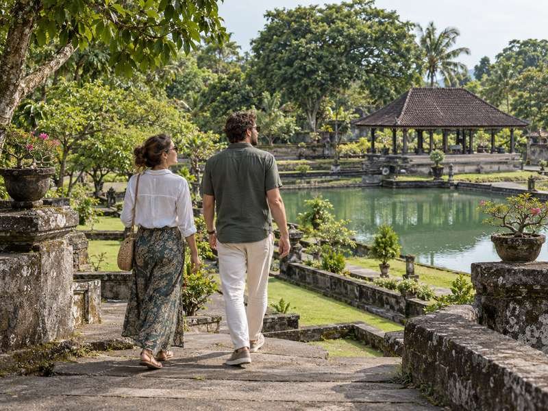 Couple enjoying a cultural visit to Taman Narmada in West Lombok